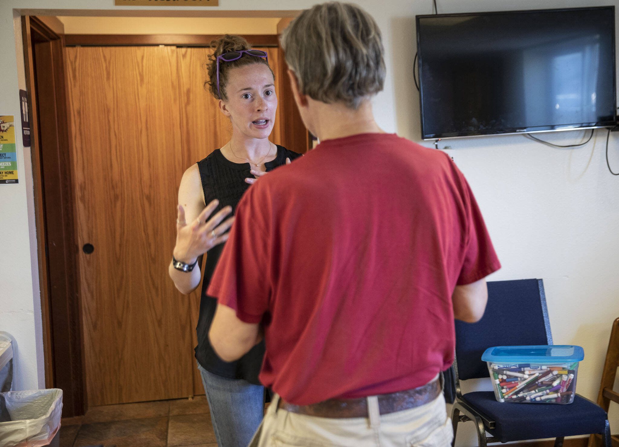 Jessi Beyer speaks with a man at Take the Next Step dinner at Monroe Covenant Church on Wednesday, Aug. 2, 2023 in Monroe, Washington. The man alerted Beyer to a person that may be experiencing tough mental health situation. (Olivia Vanni / The Herald)