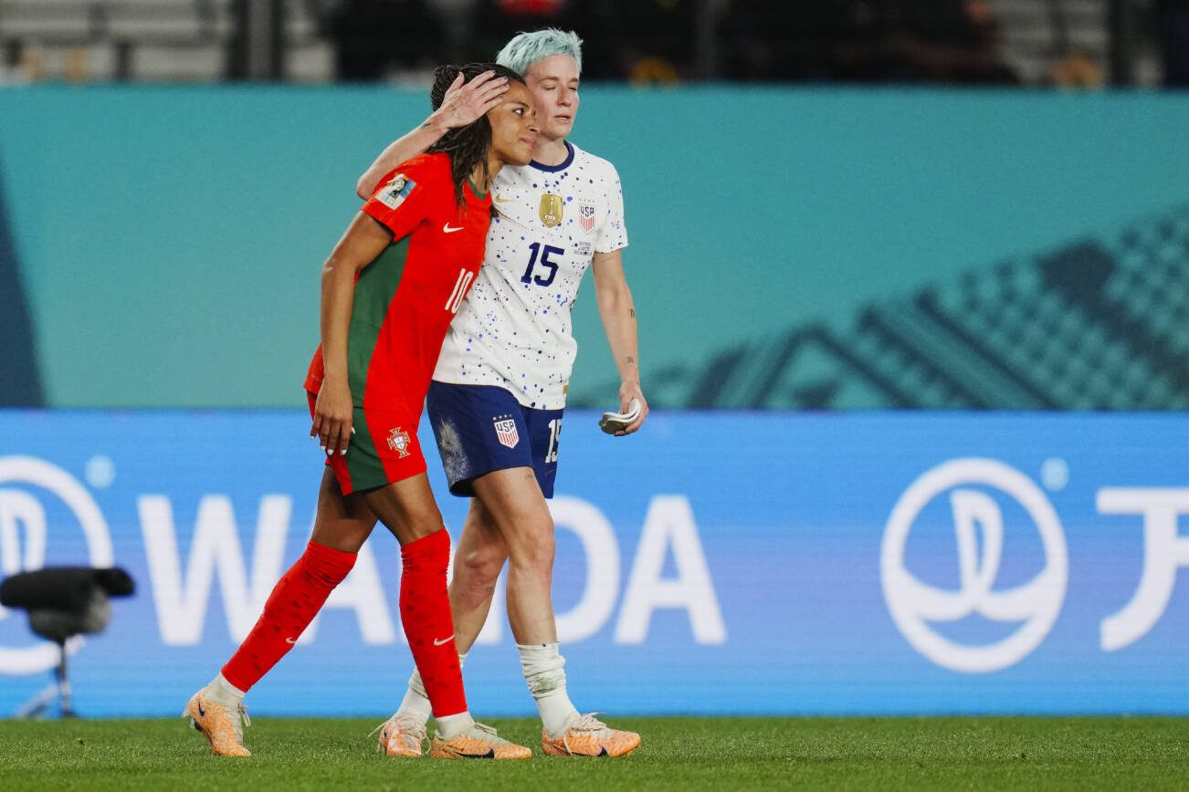 United States' Megan Rapinoe embraces Portugal's Jessica Silva, left, following the Women's World Cup Group E soccer match between Portugal and the United States at Eden Park in Auckland, New Zealand, Tuesday, Aug. 1, 2023. (AP Photo/Abbie Parr)