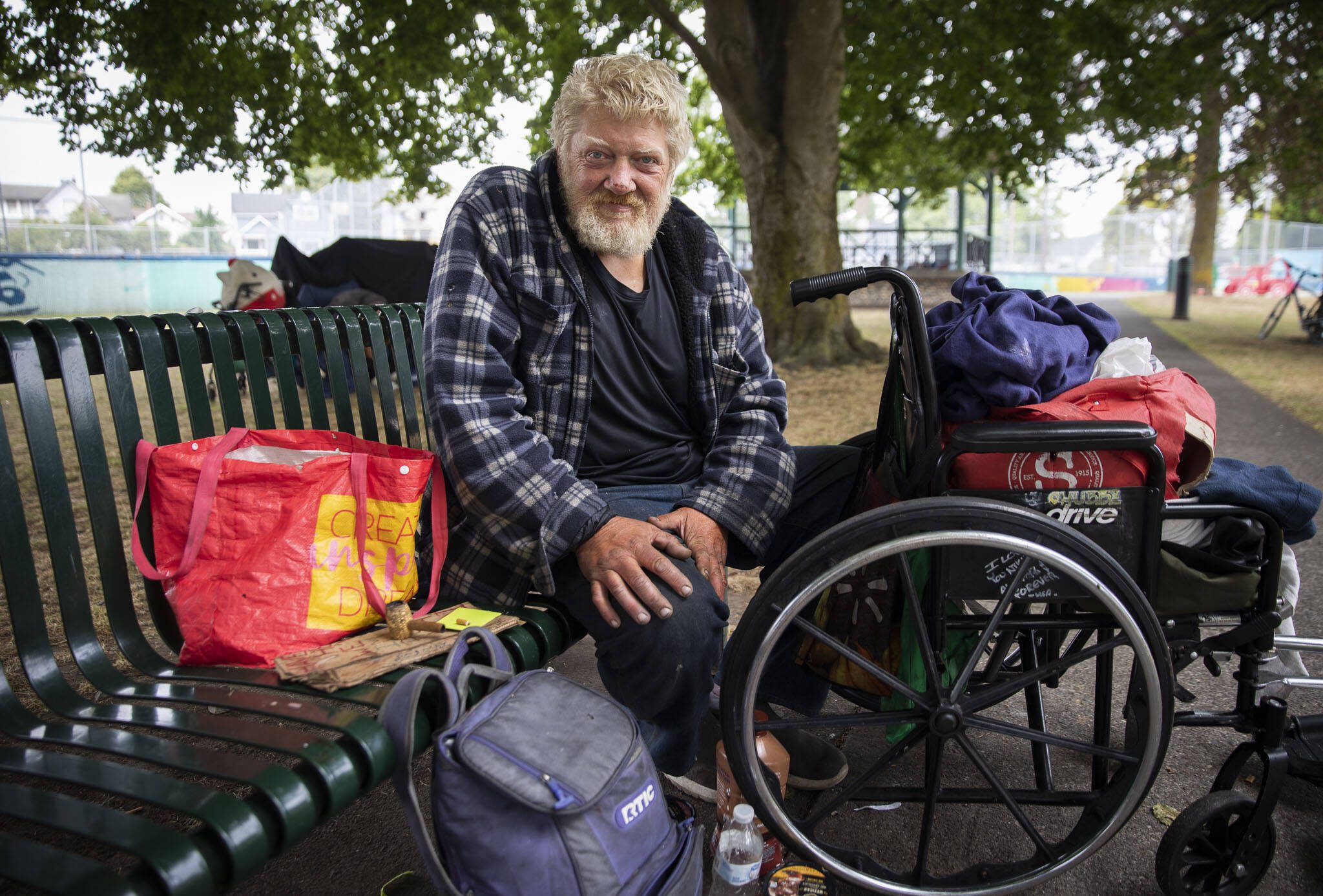 Erik Stewart rests at Clark Park on Tuesday, Aug. 8, 2023 in Everett, Washington. Stewart has been living on the streets for 7 months and dealing with congestive heart failure. (Olivia Vanni / The Herald)
