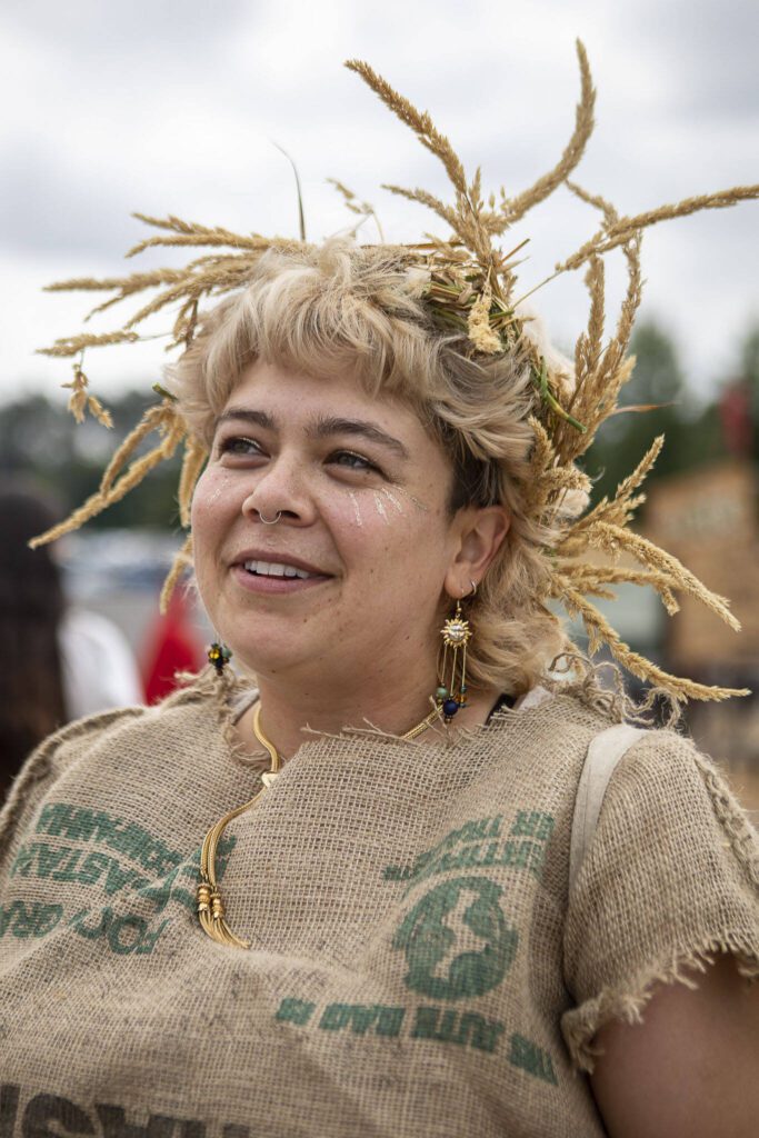 Maddie Bailey, 29, of Whidbey Island, poses for a photo while dressed as a harvest fairy during the Washington Midsummer Renaissance Faire at Sky Meadows Park in Snohomish, Washington on Sunday, Aug. 6, 2023. (Annie Barker / The Herald)
