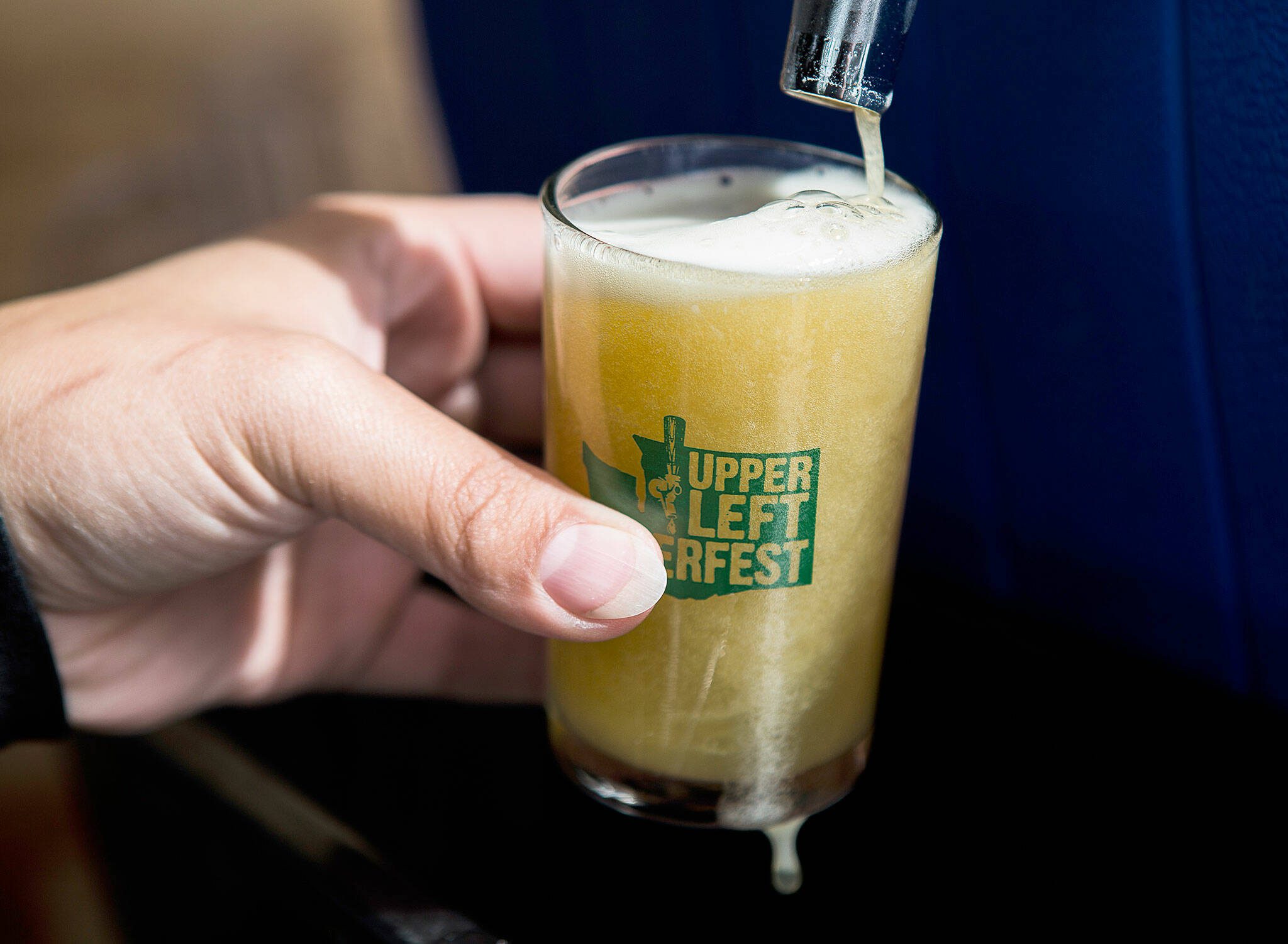 A beer is poured at UpperLeft Beerfest on Saturday, Aug. 24, 2019 in Everett, Wash. (Olivia Vanni / The Herald)