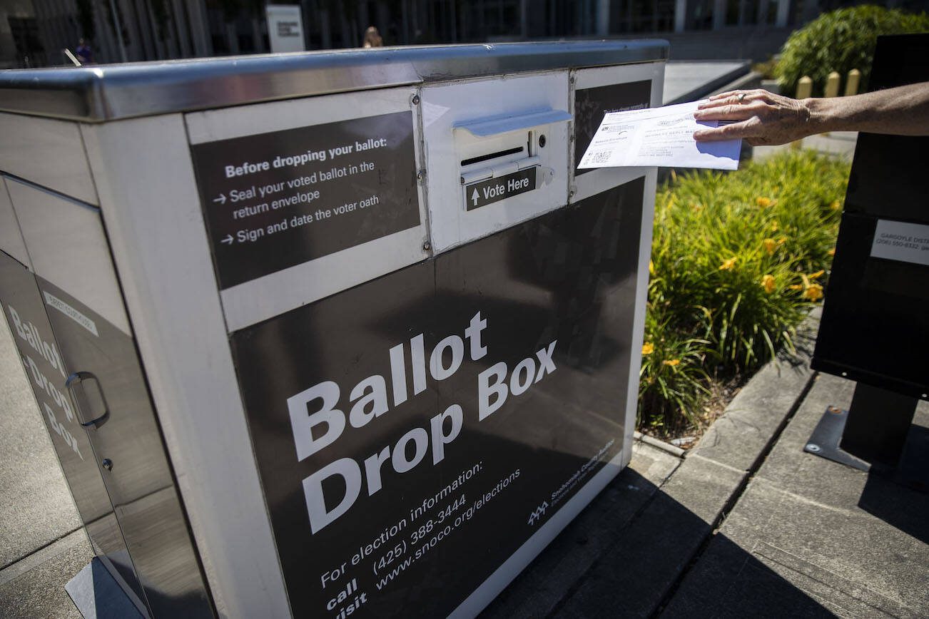 A person drops off their ballot on Tuesday, Aug. 1, 2023 in Everett, Washington. (Olivia Vanni / The Herald)