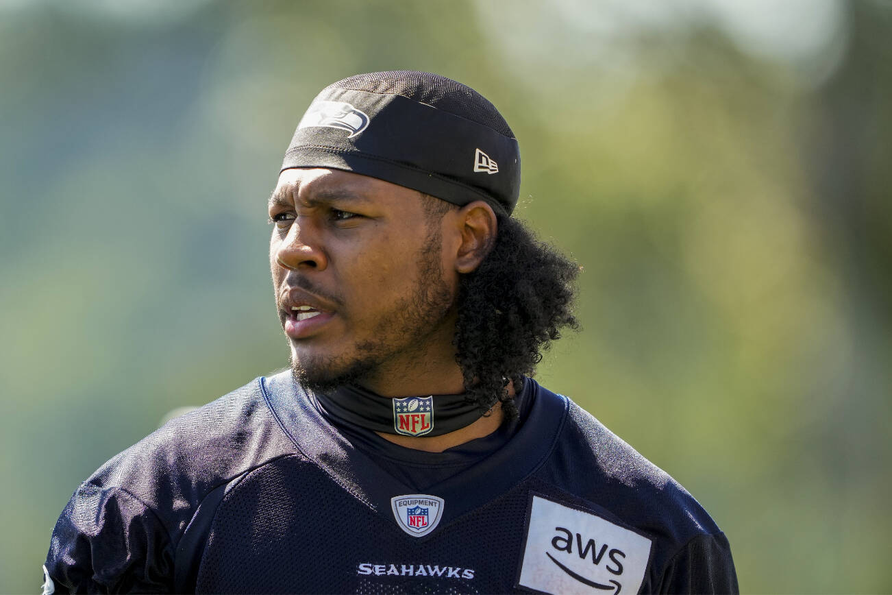 Seattle Seahawks wide receiver Dee Eskridge (1) looks on during the NFL football team's training camp, Thursday, July 27, 2023, in Renton, Wash. (AP Photo/Lindsey Wasson)