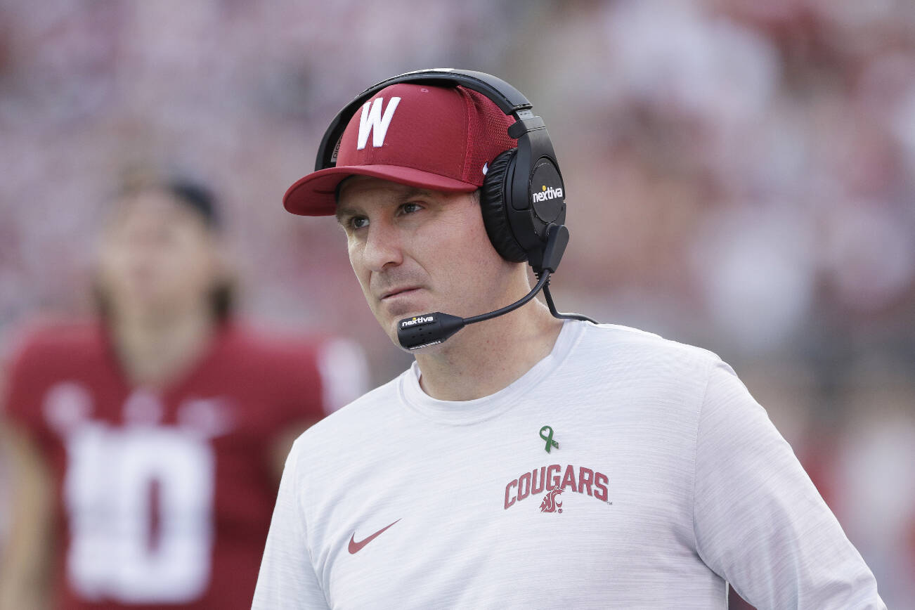 FILE - Washington State head coach Jake Dickert walks along the sideline during the second half of an NCAA college football game against California, on Oct. 1, 2022, in Pullman, Wash. Dickert has agreed to a contract extension that will keep him tied to the Cougars through the 2027 season. (AP Photo/Young Kwak, File)