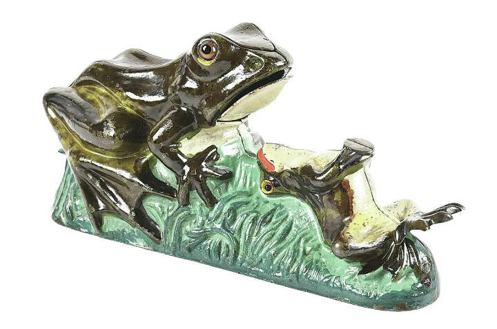 Antique mechanical banks have gone from storing pennies to selling for thousands of dollars. This frog bank is well known and highly prized, selling recently for $12,800 at auction.