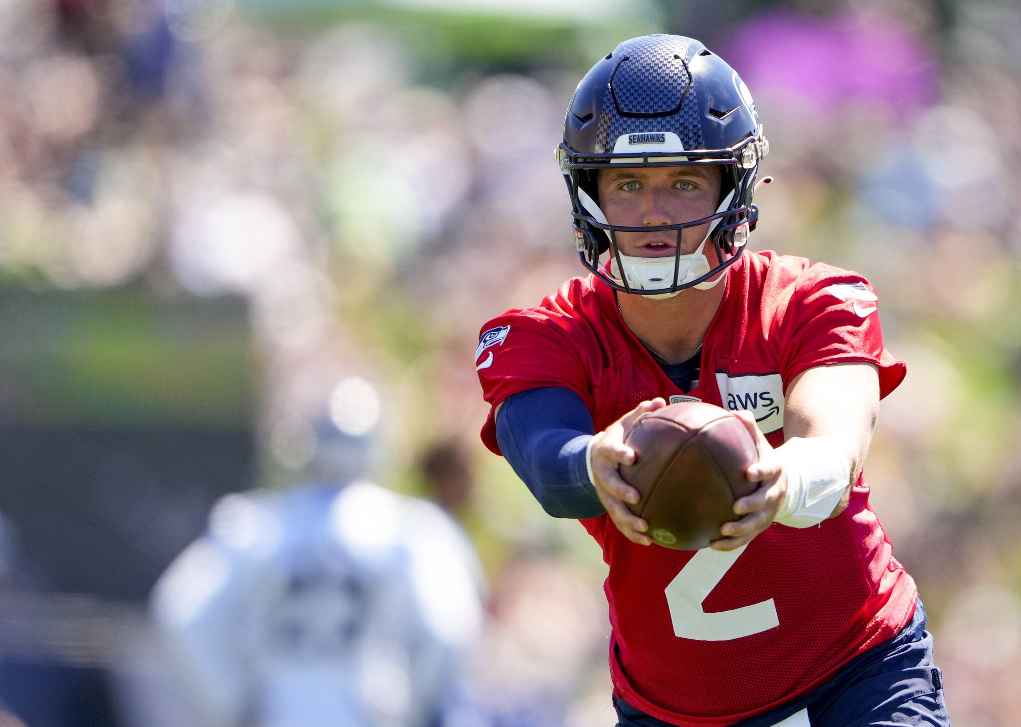 Seahawks quarterback Drew Lock runs a drill during practice on Aug. 3 in Renton. (AP Photo/Lindsey Wasson)