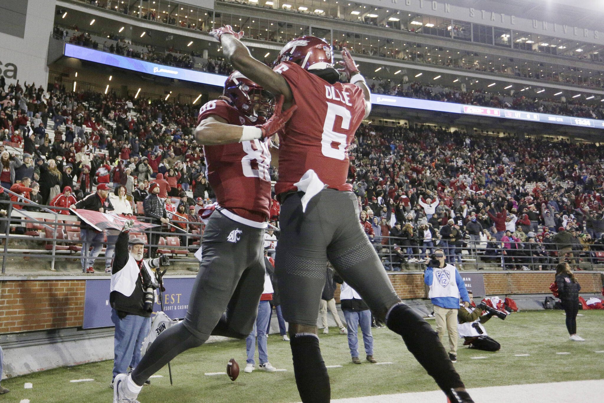 Washington State’s De’Zhaun Stribling (88) celebrates his touchdown with Donovan Ollie during a game against Utah on Oct. 27, 2022, in Pullman. (AP Photo/Young Kwak)