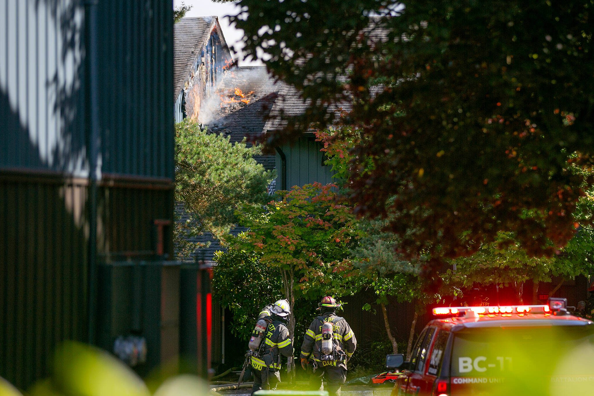 Emergency responders work the scene of an apartment fire at the Park 120 apartment complex on Casino Road on Friday, August 11, 2023, in Everett, Washington. (Ryan Berry / The Herald)