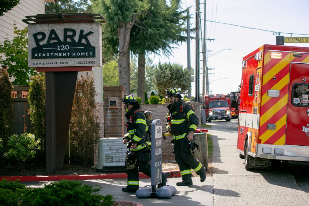 Emergency responders work the scene of an apartment fire at the Park 120 apartment complex on Casino Road on Friday, August 11, 2023, in Everett, Washington. (Ryan Berry / The Herald)
