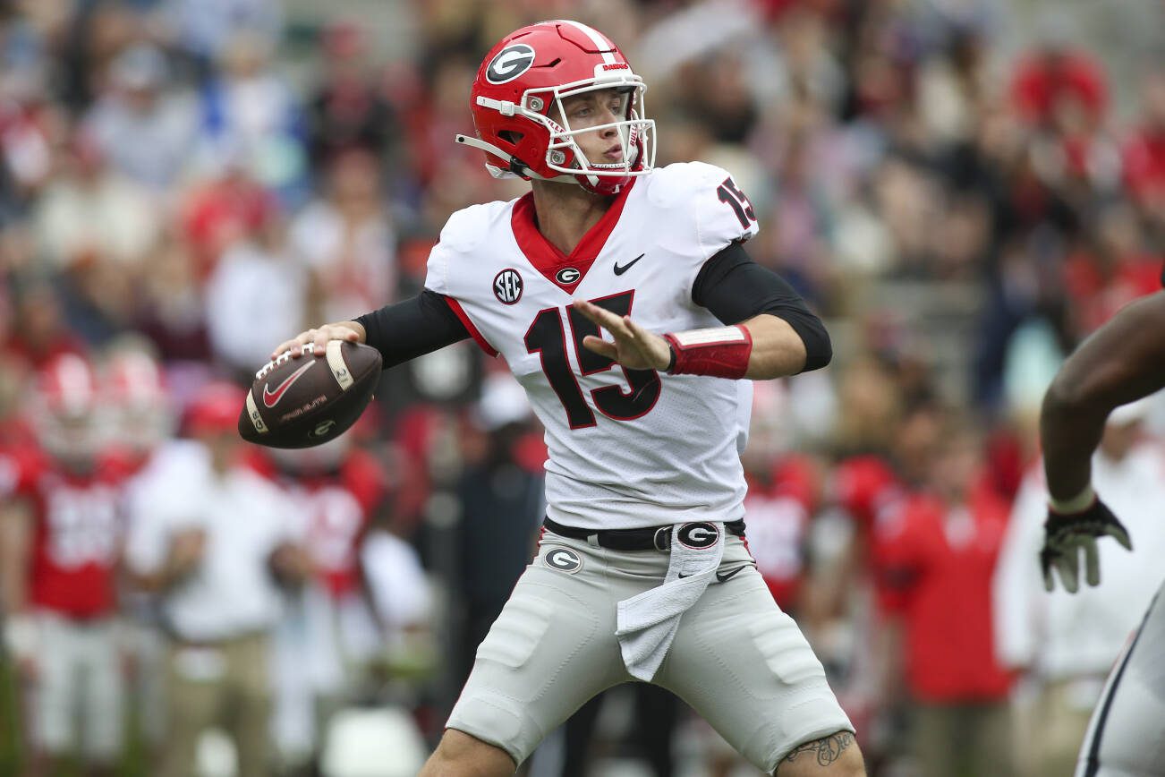 Georgia quarterback Carson Beck throws in the first half of Georgia’s spring game April 16, 2022, in Athens, Ga. Coach Kirby Smart has made it clear that Carson Beck is the quarterback to beat. (AP Photo/Brett Davis, File)