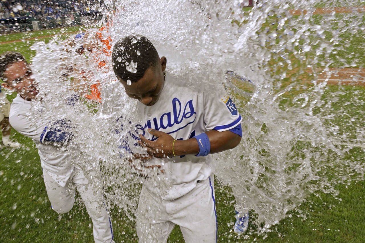 Kansas City Royals’ Freddy Fermin, left, douses Dairon Blanco after their game against the Seattle Mariners on Monday in Kansas City, Mo. The Royals won 7-6. (AP Photo/Charlie Riedel)