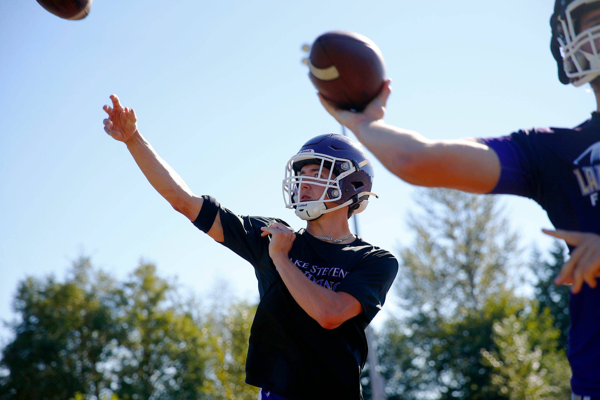 Lake Stevens junior quarterback Kolton Matson throws alongside the other quarterbacks during the Vikings’ first practice of the year Wednesday, August 16, 2023, in Lake Stevens, Washington. (Ryan Berry / The Herald)