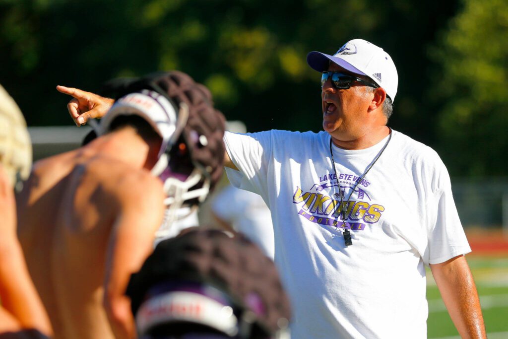 Lake Stevens Head Coach Tom Tri directs his team during the Vikings’ first practice of the year Wednesday, August 16, 2023, in Lake Stevens, Washington. (Ryan Berry / The Herald)
