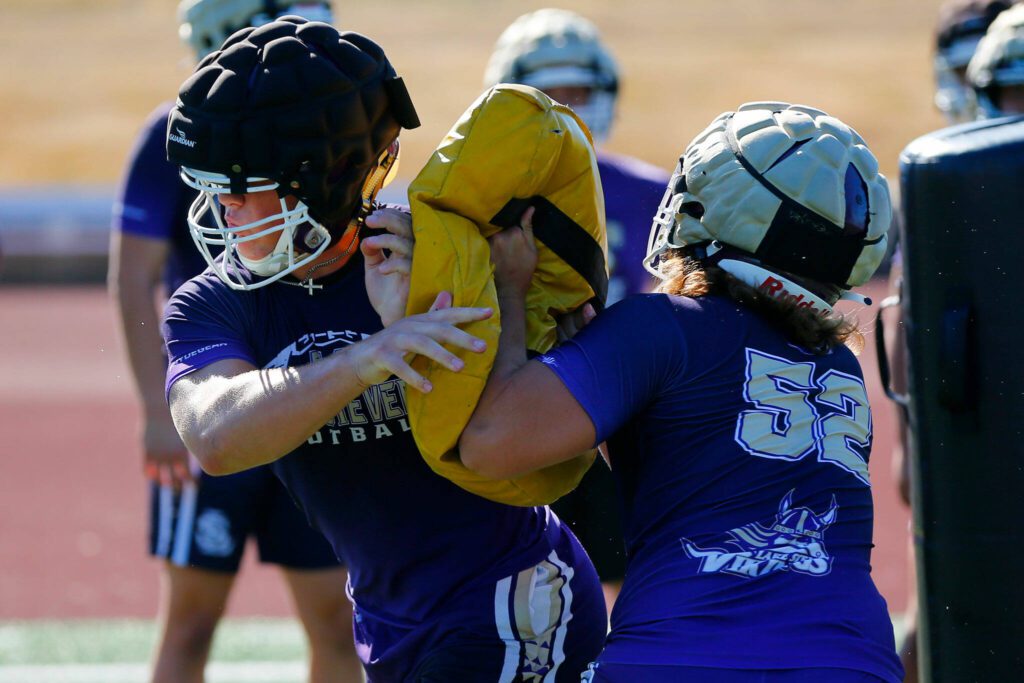 Lake Stevens defensive linemen run through drills during the Vikings’ first practice of the year Wednesday, August 16, 2023, in Lake Stevens, Washington. (Ryan Berry / The Herald)
