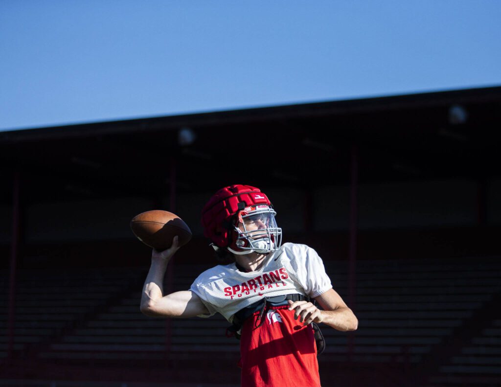 Stanwood quarterback Luke Brennan throws the ball during practice on Friday, Aug. 18, 2023 in Stanwood, Washington. (Olivia Vanni / The Herald)
