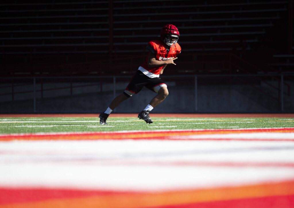 A Stanwood player runs a route during practice on Friday, Aug. 18, 2023 in Stanwood, Washington. (Olivia Vanni / The Herald)
