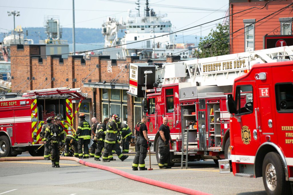 Firefighters work the scene after extinguishing a large fire at J Ramen and Sushi on Saturday, August 19, 2023, on Hewitt Avenue in Everett, Washington. (Ryan Berry / The Herald)
