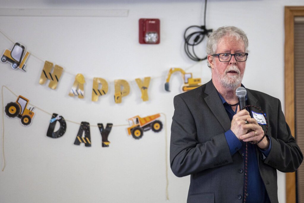 Interfaith Association of Northwest Washington Executive Director Jim Dean speaks during a groundbreaking ceremony for Faith Family Village at Faith Lutheran Church in Everett, Washington on Monday, Aug. 21, 2023. (Annie Barker / The Herald)
