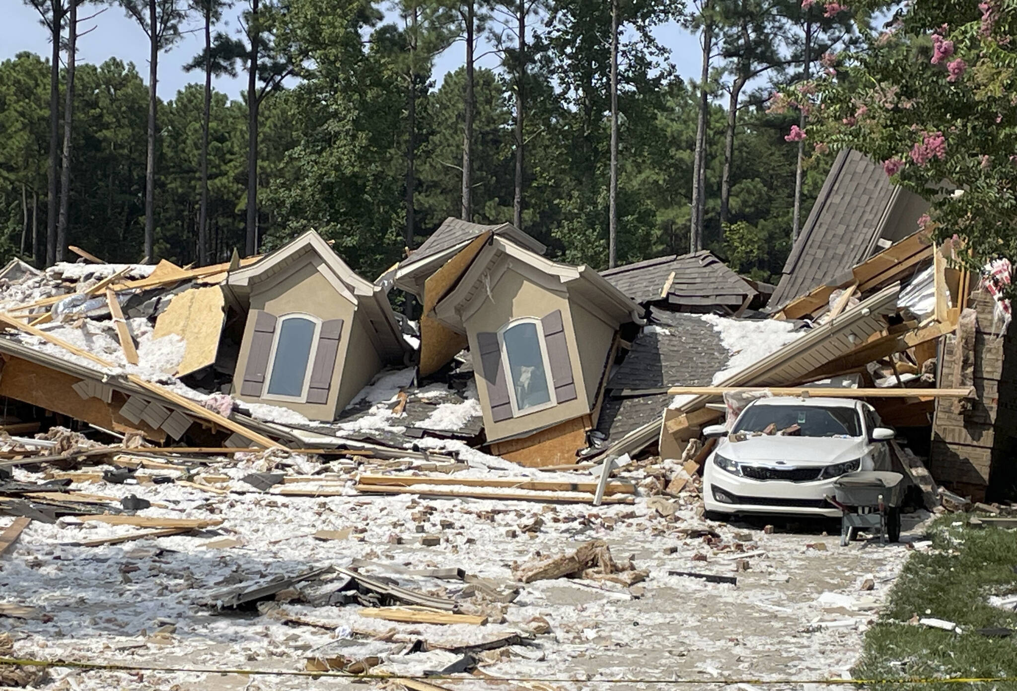 Damage and debris from a house explosion are seen on Tuesday in Mooresville, N.C., Tuesday. Robert M. Farley, father of Titans cornerback Caleb Farley, died overnight in the explosion that destroyed the NFL player’s home and left another person injured, authorities said. (AP Photo/Steve Reed)