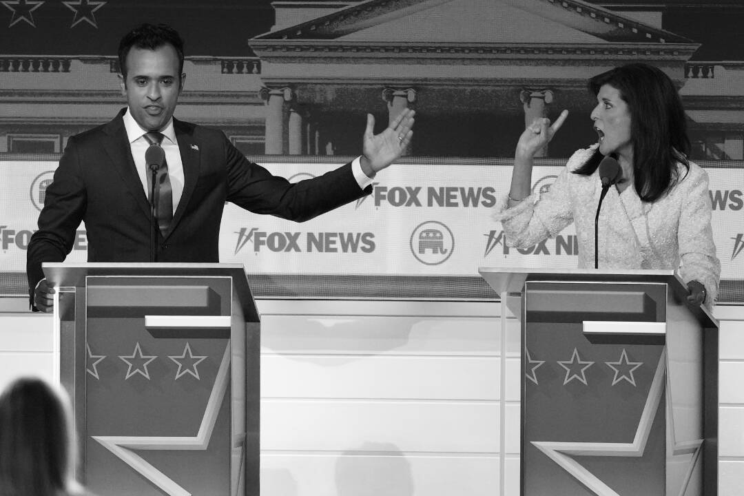 Businessman Vivek Ramaswamy and former U.N. Ambassador Nikki Haley speak during the Republican presidential primary debate.