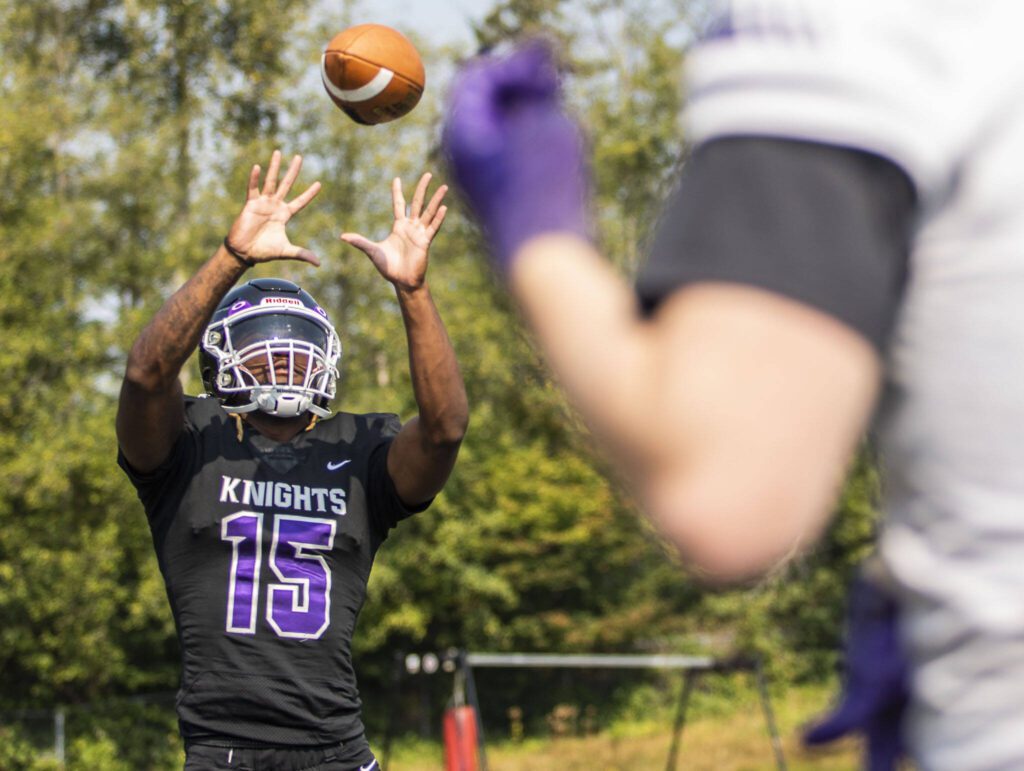 Kamiak’s T’Andre Waverly catches a pass for a portrait during football practice on Thursday, Aug. 24, 2023 in Mukilteo, Washington. (Olivia Vanni / The Herald)
