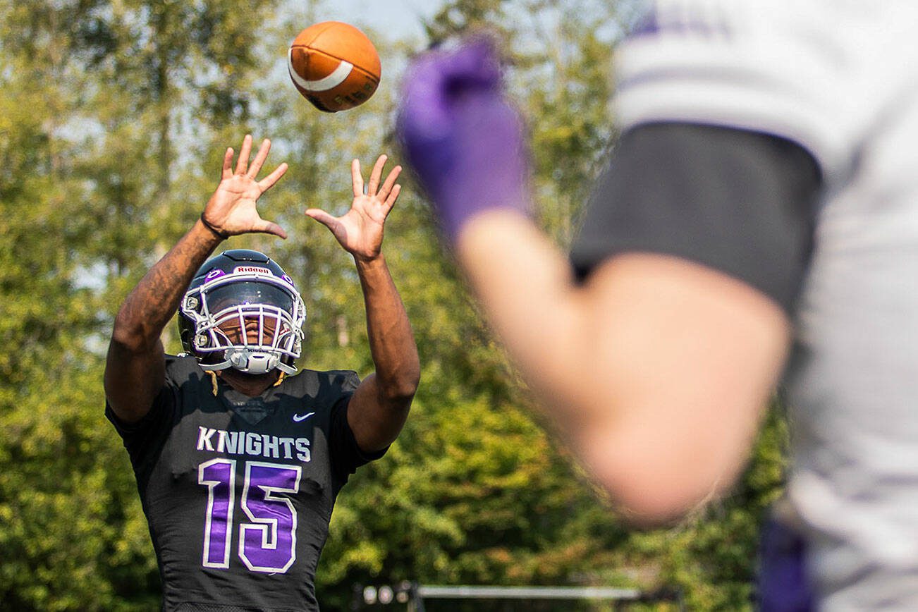 Kamiak’s T’Andre Waverly catches a pass for a portrait during football practice on Thursday, Aug. 24, 2023 in Mukilteo, Washington. (Olivia Vanni / The Herald)