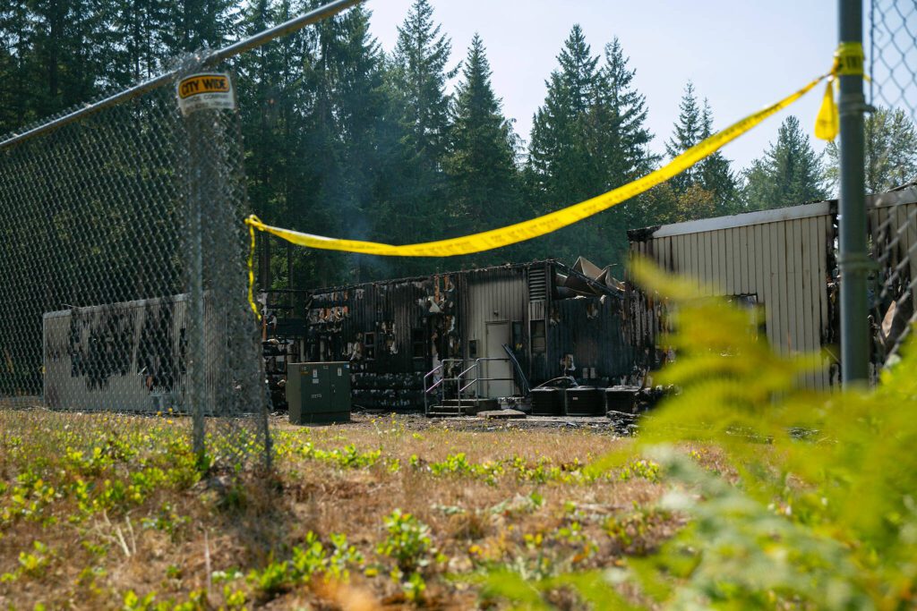 Seattle Laestadian Lutheran Church smolders after being completely destroyed by a fire Friday, August 25, 2023, in Woodinville, Washington. (Ryan Berry / The Herald)
