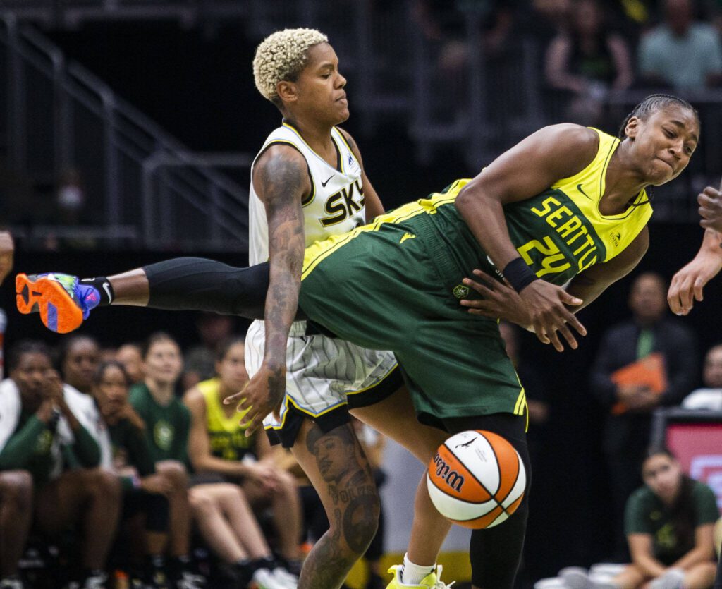Chicago Sky’s Courtney Williams knocks the ball out of Seattle Storm’s Jewell Loyd’s hands during the game at Climate Pledge Arena on Sunday, Aug. 27, 2023 in Seattle, Washington. (Olivia Vanni / The Herald)