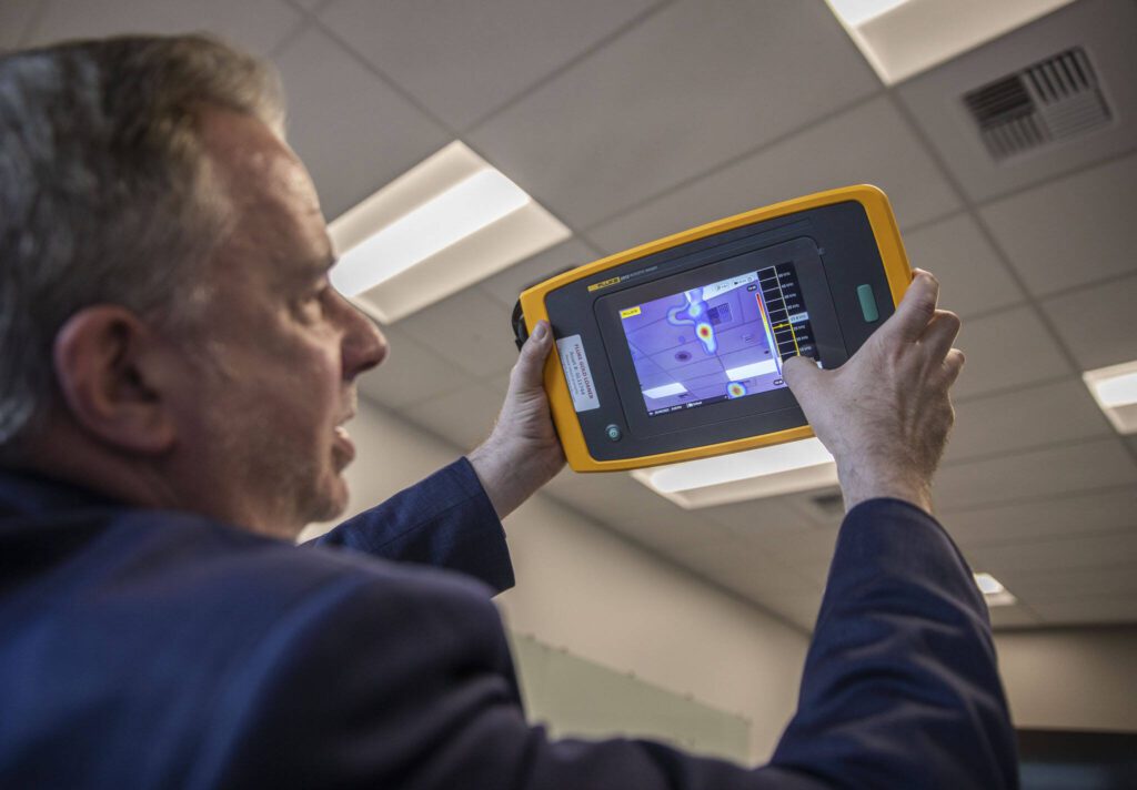 Fluke Corp. President Jason Waxman shows how to use on of Fluke’s new thermal measuring tools on Tuesday, May 9, 2023 in Everett, Washington. (Olivia Vanni / The Herald)

