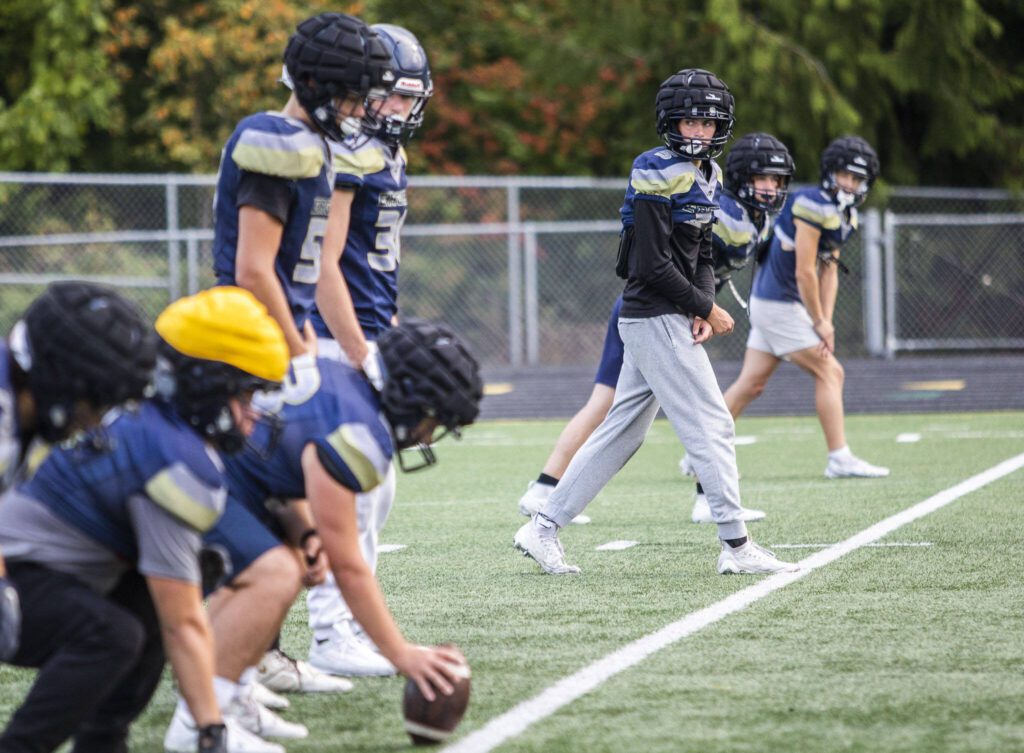 Jacoby Falor lines up to run a route during practice on Wednesday at Arlington High School. (Olivia Vanni / The Herald)
