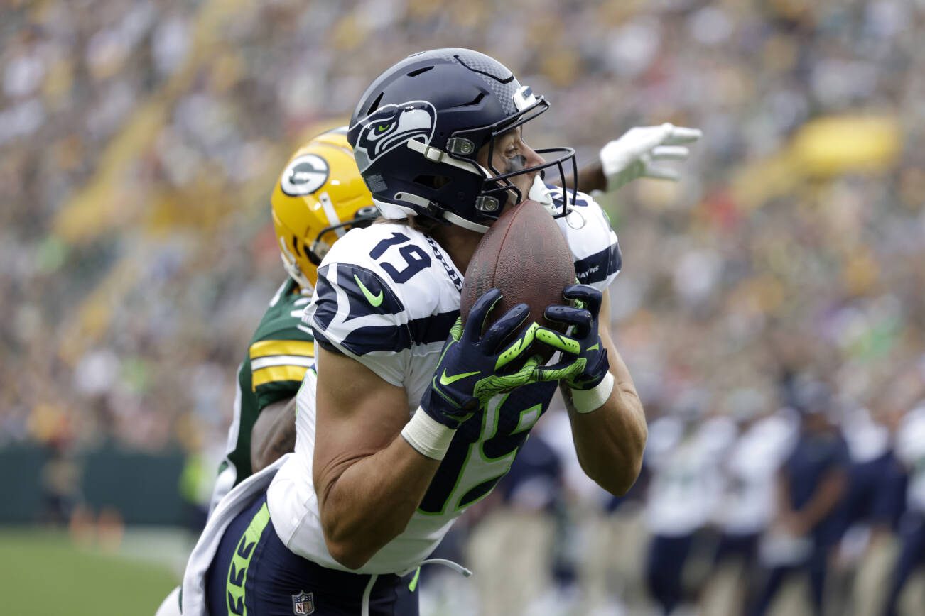Seattle Seahawks wide receiver Jake Bobo (19) catches an 18-yard touchdown pass in the first half of a preseason NFL football game against the Green Bay Packers, Saturday, Aug. 26, 2023, in Green Bay, Wis. (AP Photo/Matt Ludtke)