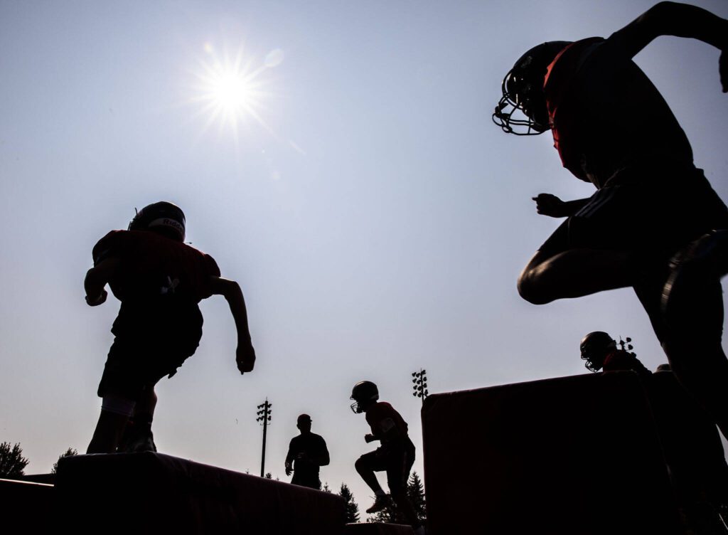Archbishop Murphy plays run through warm up drills during practice on Thursday, Aug. 24, 2023 in Everett, Washington. (Olivia Vanni / The Herald)
