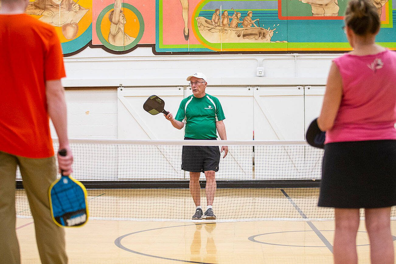 Roger Bel Air teaches a beginners pickleball clinic at the Frances Anderson Center on Monday, July 31, 2023 in Edmonds, Washington. (Olivia Vanni / The Herald)