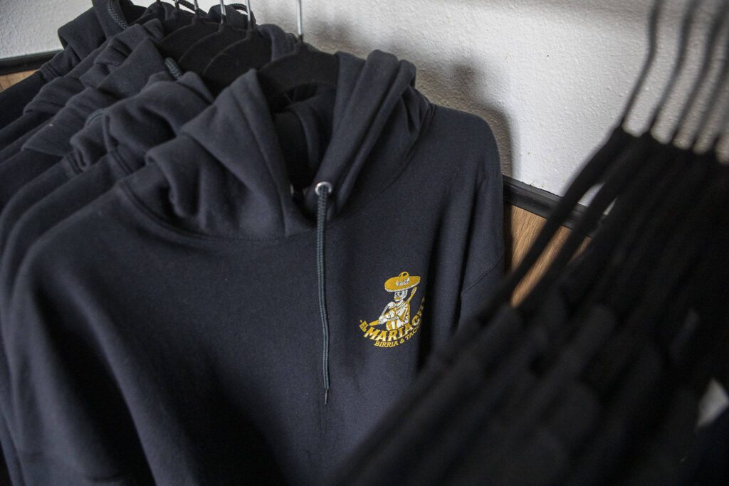 Hoodies for sale at El Mariachi in Everett, Washington on Wednesday, July 5, 2023. (Annie Barker / The Herald)
