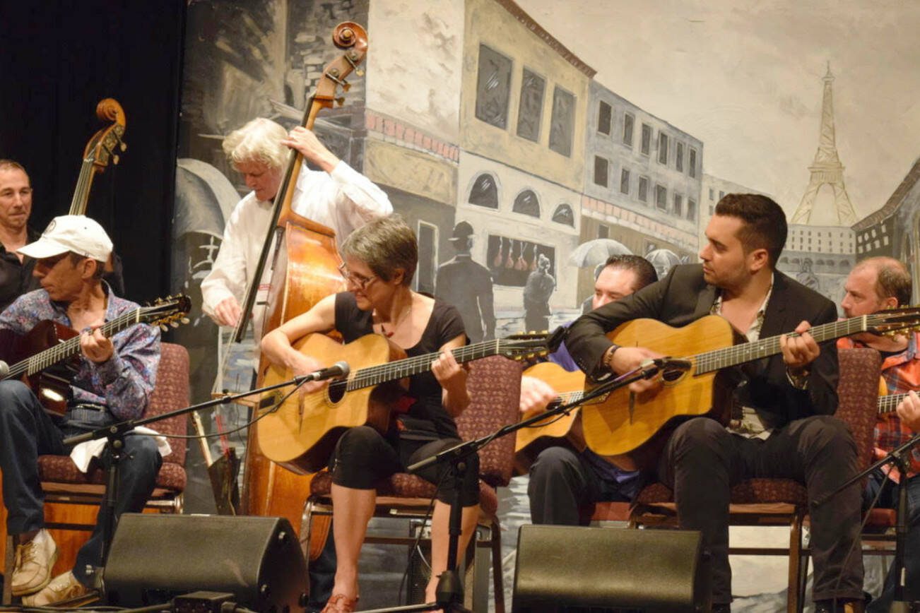 A previous year's Djangofest NW ends in an all-instruments-on-deck jam session dedicated to its late festival founder, Nick Lehr. The first event in 2001 featured two bands over nights. It’s grown to a 5-day event attracting about 3,000 people and includes seven concerts, 20 workshops and spontaneous sparks of music around Langley’s outdoor venues. (Photo by Patricia Guthrie/South Whidbey Record)