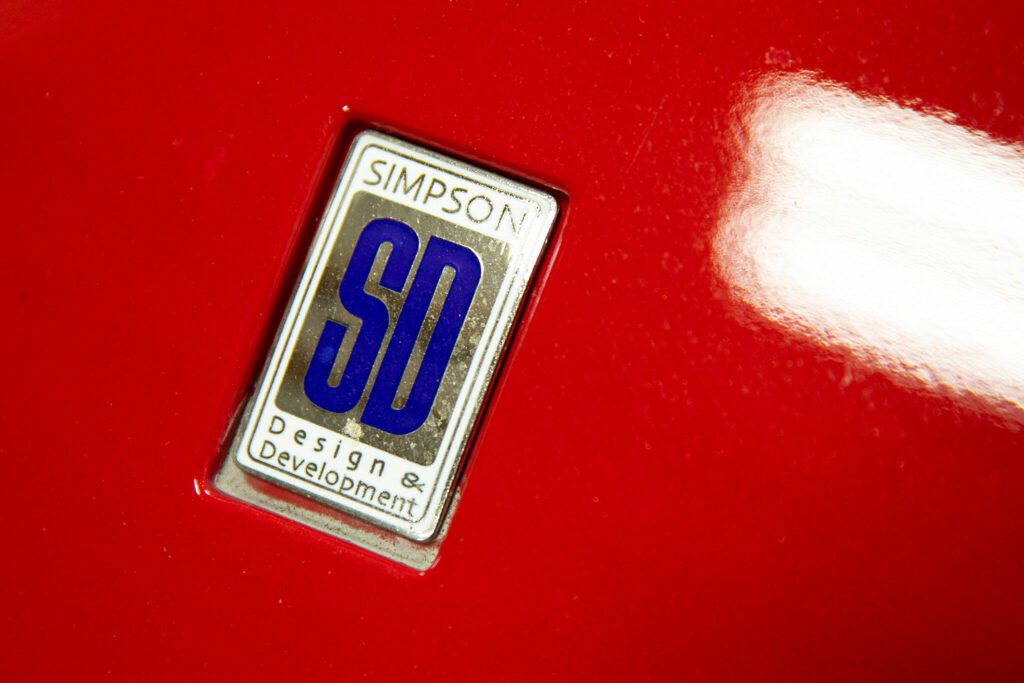 The Simpson Design hood emblem adorns one of Jim Simpson’s creations on Friday, August 25, 2023, in Clinton, Washington. The logo shape comes from the Ferrari emblem. (Ryan Berry / The Herald)
