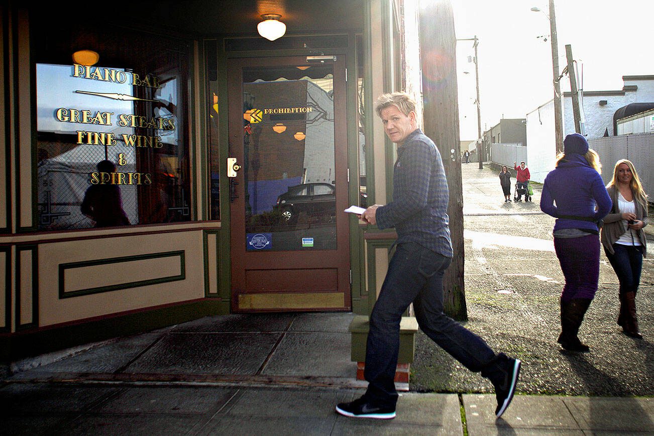 Celebrity chef Gordon Ramsay walks into the Prohibition Grille along Hewitt Avenue in Everett Wednesday Dec. 5, 2012 while reportedly filming an episode of Kitchen Nightmares at the Everett restaurant. (Mark Mulligan / The Herald)