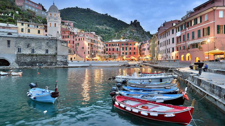 Enjoy a sunset stroll along Vernazza’s breakwater at dusk when colors deepen and glow. (Rick Steves’ Europe)