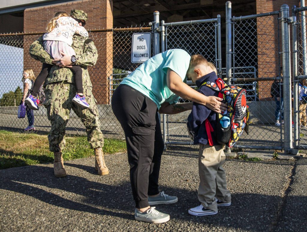 A parent says goodbye to their child before the start of school at Whittier Elementary on Wednesday, Sept. 6, 2023 in Everett, Washington. (Olivia Vanni / The Herald)
