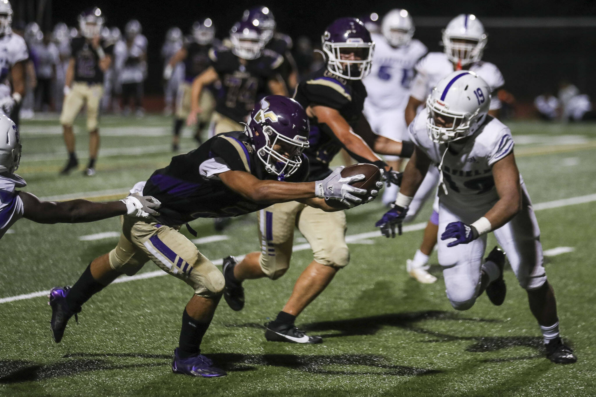 Lake Stevens’ Steven Lee (2) scores during a football game between Lake Stevens and Garfield at Lake Stevens High School in Lake Stevens, Washington on Friday, Sept. 1, 2023. The Vikings won 48-21. (Annie Barker / The Herald)