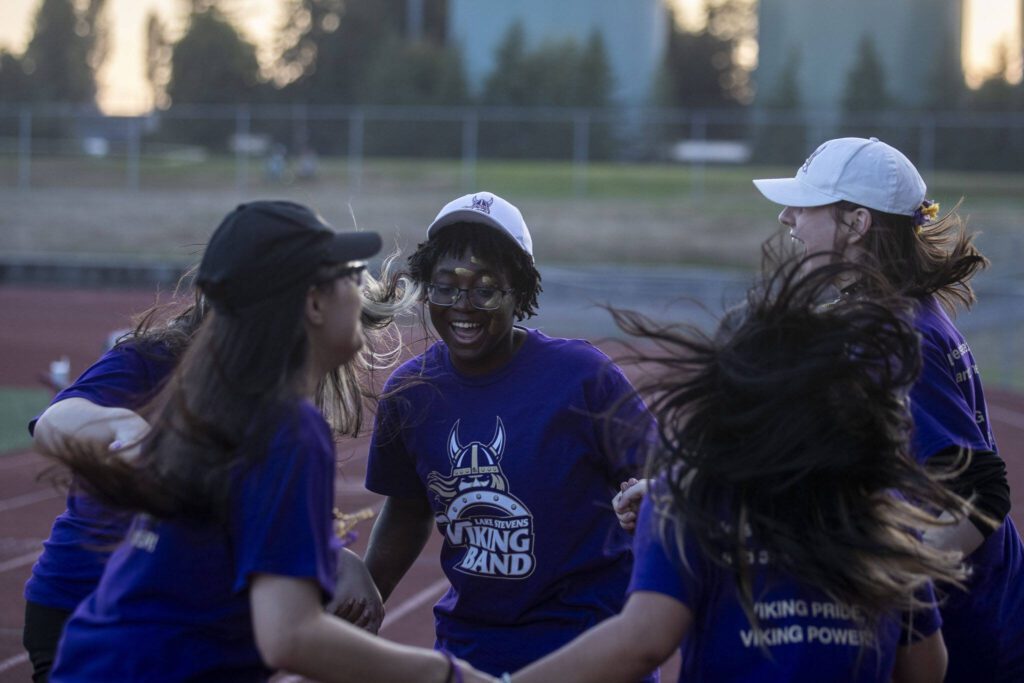 Members of the Lake Stevens marching band dance during a football game between Lake Stevens and Garfield at Lake Stevens High School in Lake Stevens, Washington on Friday, Sept. 1, 2023. The Vikings won 48-21. (Annie Barker / The Herald)
