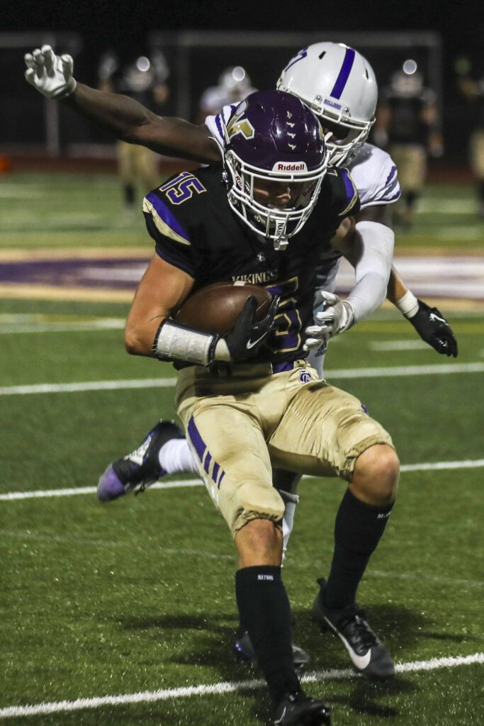 Lake Steven’s Jesse Lewis (15) moves with the ball during a football game between Lake Stevens and Garfield at Lake Stevens High School in Lake Stevens, Washington on Friday, Sept. 1, 2023. The Vikings won 48-21. (Annie Barker / The Herald)
