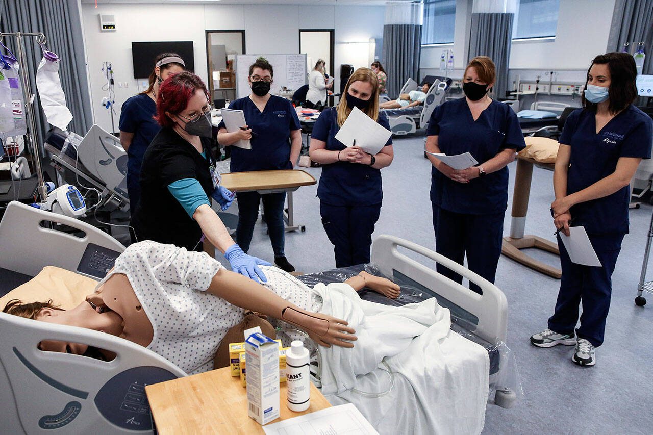Catherine Robinweiler leads the class during a lab session at Edmonds College on April 29, 2021. (Kevin Clark / The Herald)