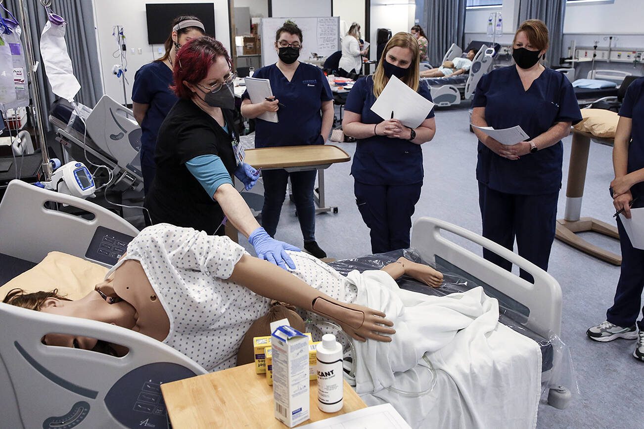 Catherine Robinweiler leads the class during a lab session at Edmonds College on April 29, 2021. (Kevin Clark / The Herald)