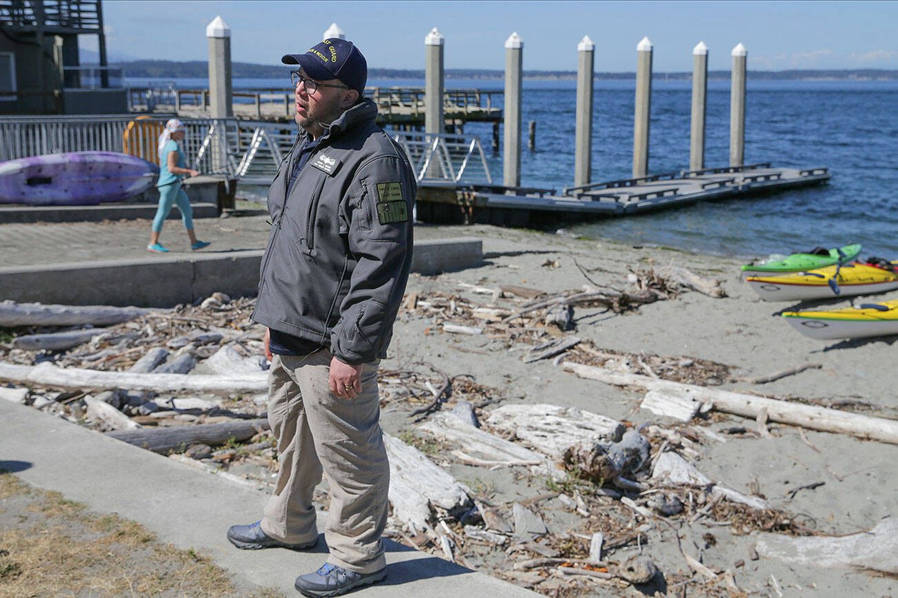 Scott Giard, Coast Guard spokesperson, addresses the media regarding the search for a crashed chartered floatplane Monday afternoon in Freeland, Washington on August 5, 2022.  (Kevin Clark / The Herald)