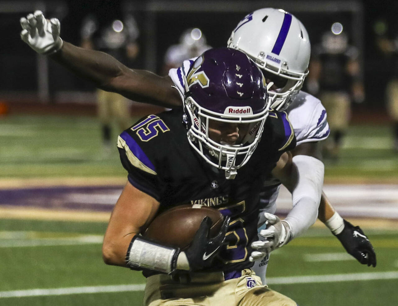 Lake Stevens’ Jesse Lewis (15) tries to fight off a Garfield defender during a game on Sept. 1, 2023, in Lake Stevens. (Annie Barker / The Herald)