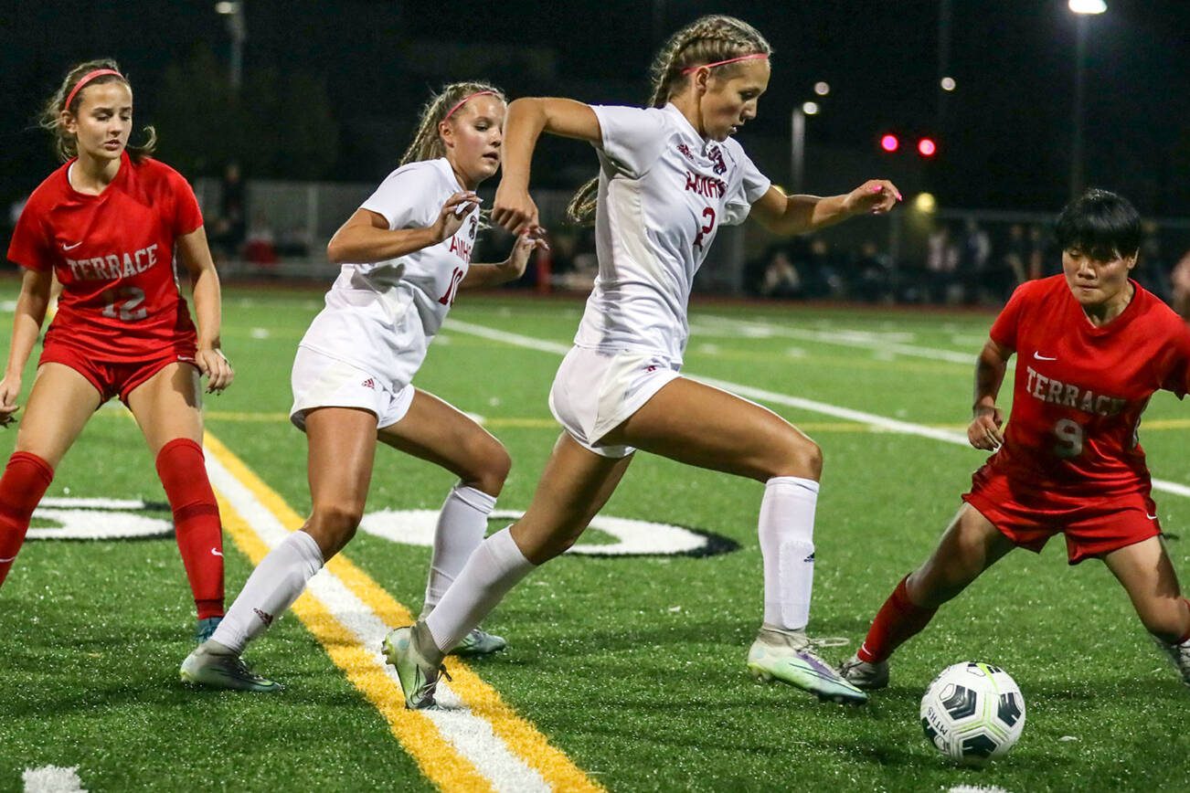 Archbishop Murphy's Chloe McCoy races to control the ball Thursday night at Lynnwood High School in Lynnwood, Washington on September 22, 2022. The Hawks and Wildcats finished the match with 1-1 tie. (Kevin Clark / The Herald)