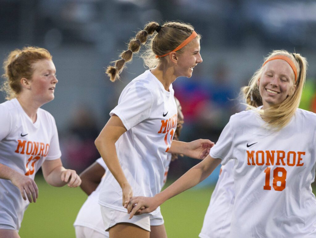 Monroe’s Sydney Garner celebrates her goal with her teammates during the game Everett on Thursday, Sept. 7, 2023 in Everett, Washington. (Olivia Vanni / The Herald)
