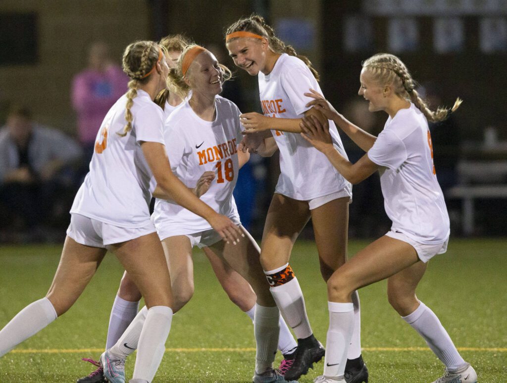 Monroe’s Sydney Garner celebrates her second goal with her teammates during the game Everett on Thursday, Sept. 7, 2023 in Everett, Washington. (Olivia Vanni / The Herald)
