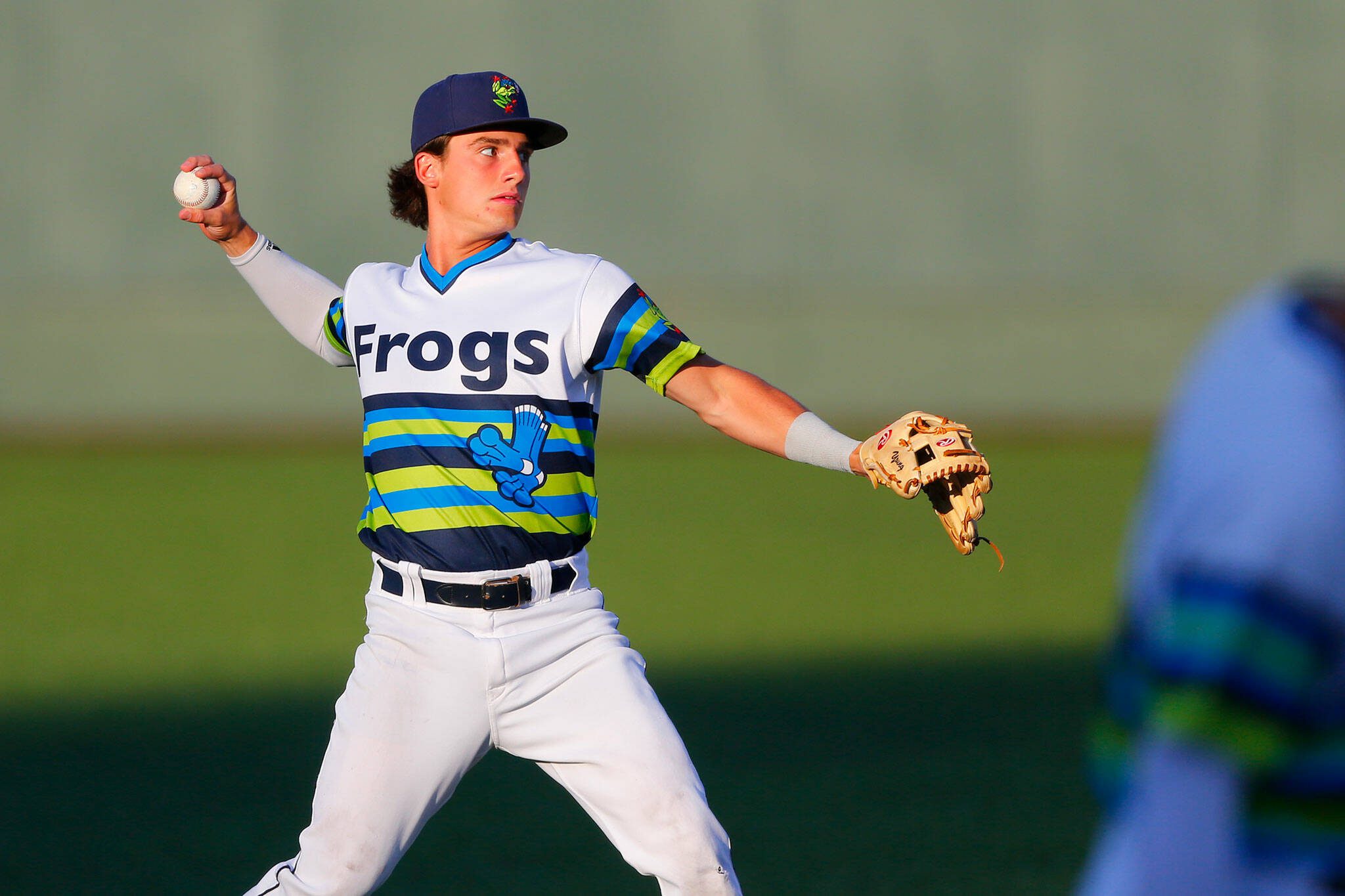 AquaSox shortstop Cole Young, one of Seattle’s top prospects, warms up between innings during a game against Hillsboro on Thursday, August 17, 2023, at Funko Field in Everett, Washington. (Ryan Berry / The Herald)